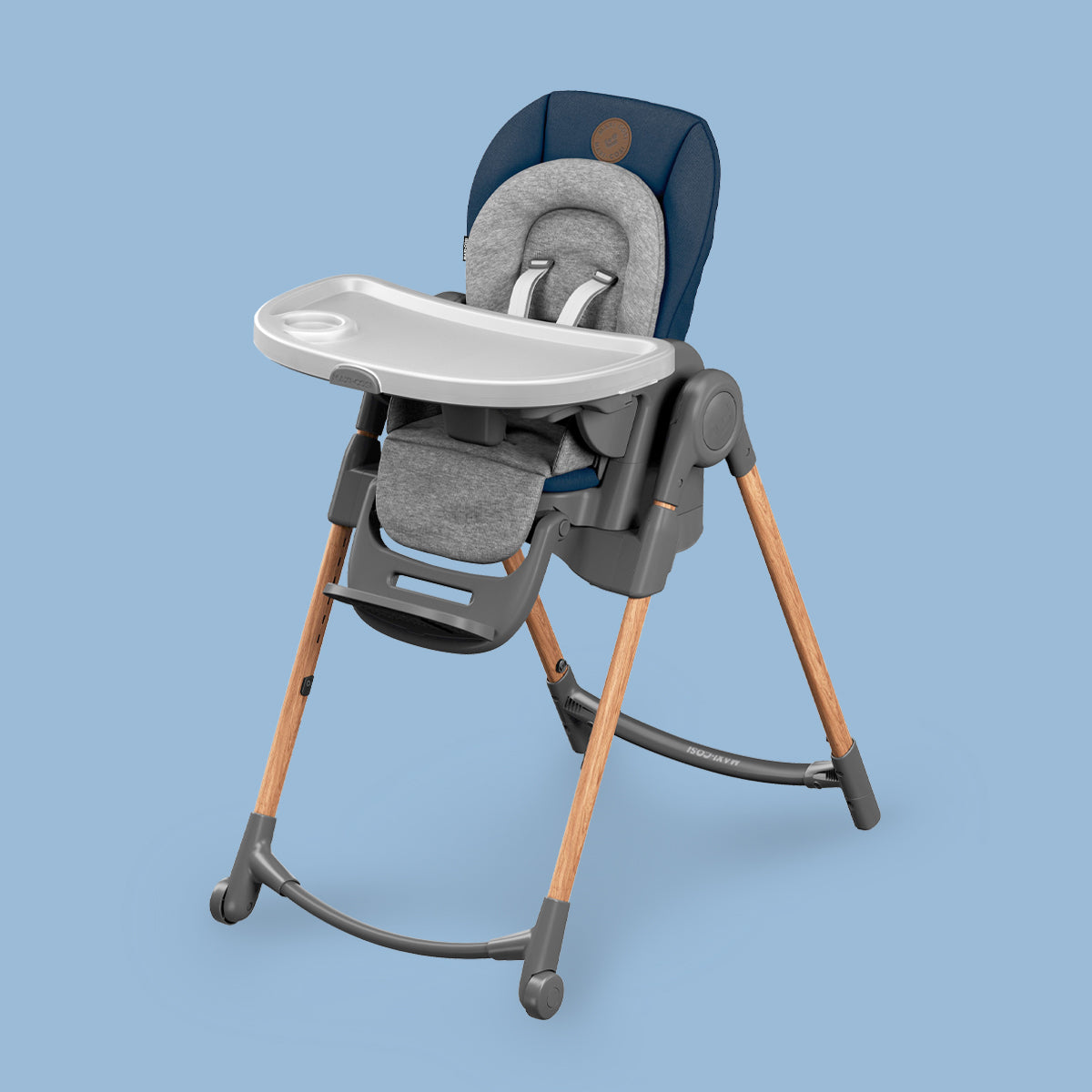 A Maxi-Cosi Minla Baby High Chair by Maxi-Cosi UAE on a blue background.