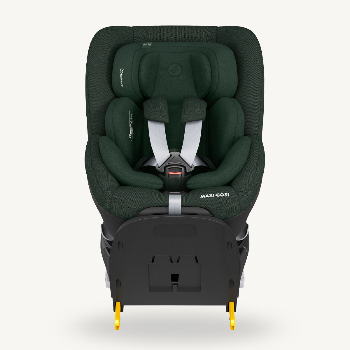 Green Maxi-Cosi car seat on a white background.