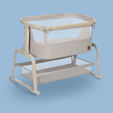 Beige baby bassinet on a blue background.