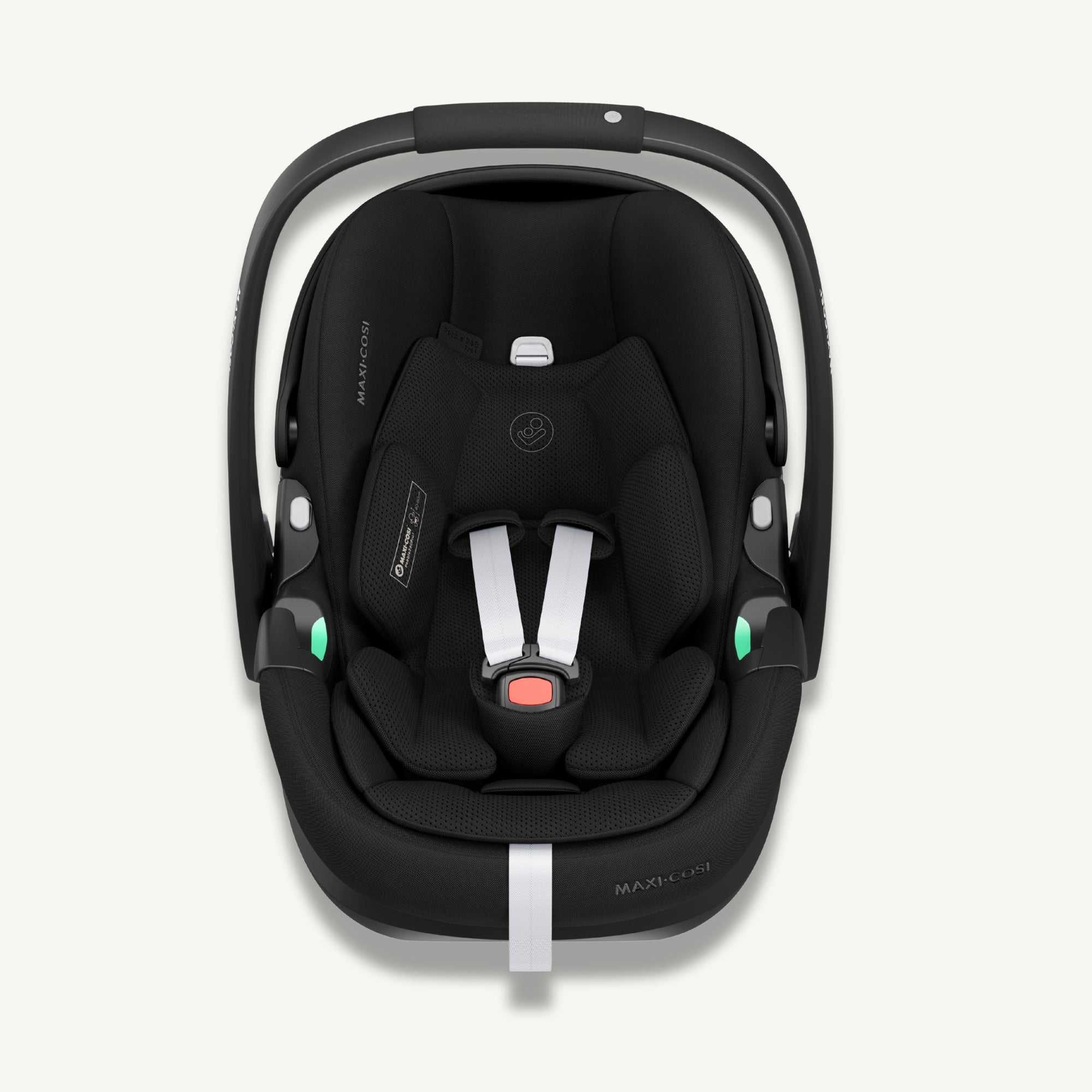 Front view of a black Maxi-Cosi Pebble 360 Pro² baby car seat with white harness straps on a light cream background.