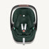 Front view of a dark green Maxi-Cosi Pebble 360 Pro² baby car seat with white harness straps on a light cream background.