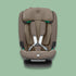 Front view of a truffle brown Maxi-Cosi Titan Pro i-Size car seat with white harness straps on a soft green background.